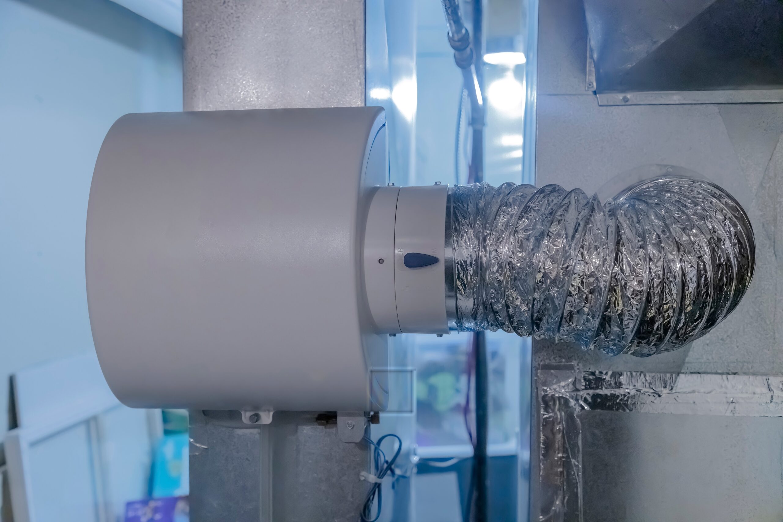Duct connected to a whole-house humidifier during fall HVAC maintenance in a San Jose home